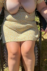 plump girl passionately poses in front of camera